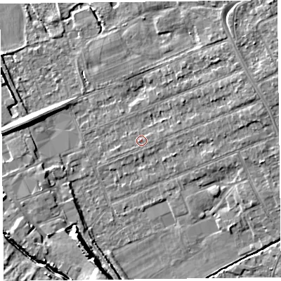 Shaded relief map of the ground around L318AT, computed from Environment Agency LiDAR. The ground here sits at about 7 m above sea level and falls 9 m across the surrounding 800 m. Surface water reaching this point runs off ground lying to the east, 0.7 m higher.