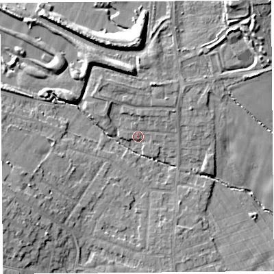 Shaded relief map of the ground around L354PX, computed from Environment Agency LiDAR. The ground here sits at about 64 m above sea level and falls 17 m across the surrounding 800 m. Surface water reaching this point runs off ground lying to the west-south-west, 7.4 m higher.