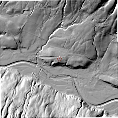 Shaded relief map of the ground around LA105PD, computed from Environment Agency LiDAR. The ground here sits at about 207 m above sea level and falls 110 m across the surrounding 800 m. Surface water reaching this point runs off ground lying to the east-north-east, 2.5 m higher.