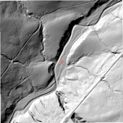 Shaded relief map of the ground around LA105PN, computed from Environment Agency LiDAR. The ground here sits at about 291 m above sea level and falls 119 m across the surrounding 800 m. Surface water reaching this point runs off ground lying to the east, 55.7 m higher.