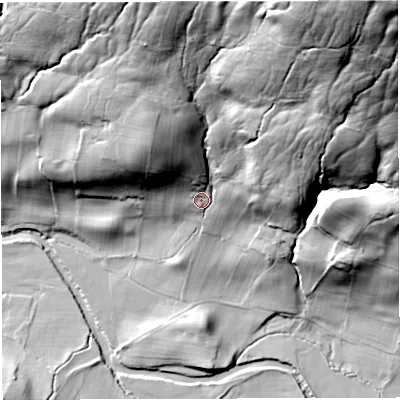 Shaded relief map of the ground around LA105TD, computed from Environment Agency LiDAR. The ground here sits at about 148 m above sea level and falls 130 m across the surrounding 800 m. Surface water reaching this point runs off ground lying to the north-east, 102.7 m higher.