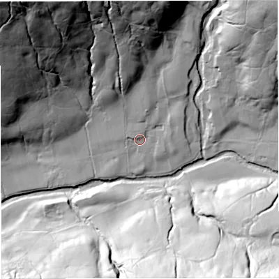 Shaded relief map of the ground around LA105TH, computed from Environment Agency LiDAR. The ground here sits at about 217 m above sea level and falls 106 m across the surrounding 800 m. Surface water reaching this point runs off ground lying to the north-north-west, 57.1 m higher.