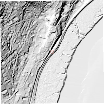 Shaded relief map of the ground around LA117DH, computed from Environment Agency LiDAR. The ground here sits at about 9 m above sea level and falls 84 m across the surrounding 800 m. Surface water reaching this point runs off ground lying to the north-west, 76.4 m higher.