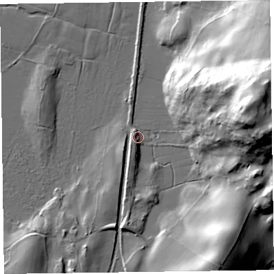 Shaded relief map of the ground around LA127QT, computed from Environment Agency LiDAR. The ground here sits at about 7 m above sea level and falls 60 m across the surrounding 800 m. Surface water reaching this point runs off ground lying to the east-north-east, 59.8 m higher.