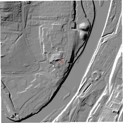Shaded relief map of the ground around LA12AX, computed from Environment Agency LiDAR. The ground here sits at about 12 m above sea level and falls 24 m across the surrounding 800 m. Surface water reaching this point runs off ground lying to the west-north-west, 3.1 m higher.