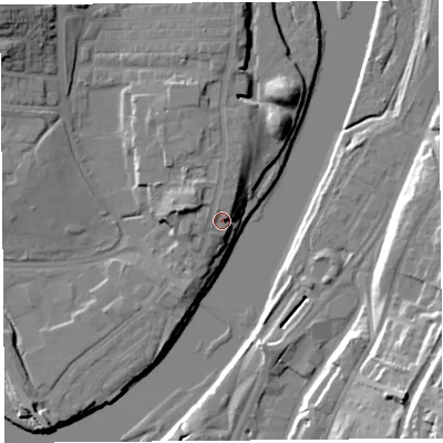 Shaded relief map of the ground around LA12AZ, computed from Environment Agency LiDAR. The ground here sits at about 11 m above sea level and falls 27 m across the surrounding 800 m. Surface water reaching this point runs off ground lying to the north-north-west, 5.5 m higher.