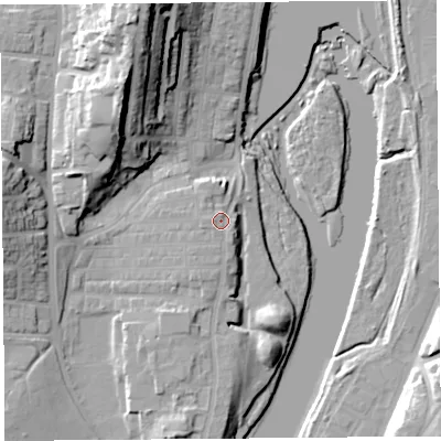 Shaded relief map of the ground around LA12DD, computed from Environment Agency LiDAR. The ground here sits at about 11 m above sea level and falls 33 m across the surrounding 800 m. Surface water reaching this point runs off ground lying to the south-west, 1.7 m higher.