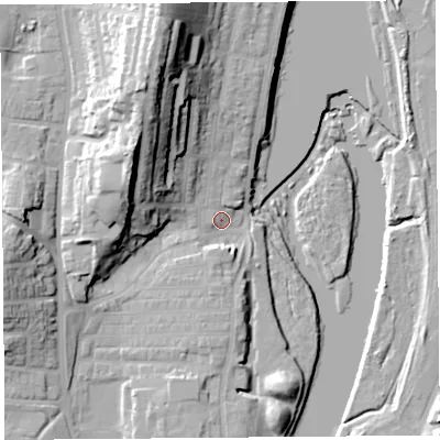 Shaded relief map of the ground around LA12DE, computed from Environment Agency LiDAR. The ground here sits at about 8 m above sea level and falls 34 m across the surrounding 800 m. Surface water reaching this point runs off ground lying to the north-north-west, 26.4 m higher.