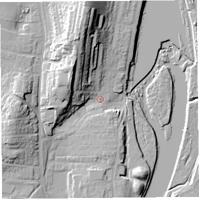 Shaded relief map of the ground around LA12DF, computed from Environment Agency LiDAR. The ground here sits at about 9 m above sea level and falls 34 m across the surrounding 800 m. Surface water reaching this point runs off ground lying to the north-north-west, 24.7 m higher.