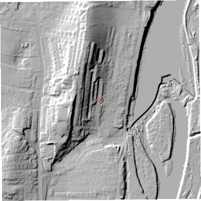 Shaded relief map of the ground around LA12DQ, computed from Environment Agency LiDAR. The ground here sits at about 14 m above sea level and falls 34 m across the surrounding 800 m. Surface water reaching this point runs off ground lying to the north-north-west, 23.4 m higher.