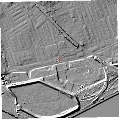 Shaded relief map of the ground around LA142AL, computed from Environment Agency LiDAR. The ground here sits at about 5 m above sea level and falls 12 m across the surrounding 800 m. Surface water reaching this point runs off ground lying to the west-south-west, 7.2 m higher.
