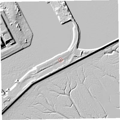 Shaded relief map of the ground around LA142XA, computed from Environment Agency LiDAR. The ground here sits at about 7 m above sea level and falls 13 m across the surrounding 800 m. Surface water reaching this point runs off ground lying to the south, 1.5 m higher.