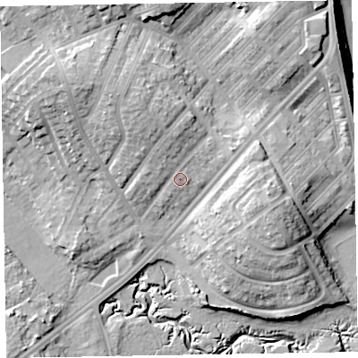 Shaded relief map of the ground around LA143DE, computed from Environment Agency LiDAR. The ground here sits at about 12 m above sea level and falls 17 m across the surrounding 800 m. Surface water reaching this point runs off ground lying to the north, 4.3 m higher.