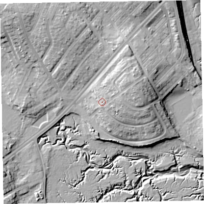 Shaded relief map of the ground around LA143ES, computed from Environment Agency LiDAR. The ground here sits at about 12 m above sea level and falls 19 m across the surrounding 800 m. Surface water reaching this point runs off ground lying to the east-north-east, 6.9 m higher.