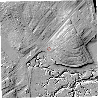 Shaded relief map of the ground around LA143HH, computed from Environment Agency LiDAR. The ground here sits at about 7 m above sea level and falls 18 m across the surrounding 800 m. Surface water reaching this point runs off ground lying to the east-north-east, 12.0 m higher.