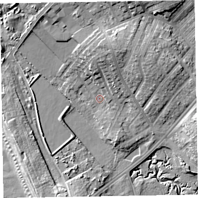 Shaded relief map of the ground around LA143JR, computed from Environment Agency LiDAR. The ground here sits at about 7 m above sea level and falls 18 m across the surrounding 800 m. Surface water reaching this point runs off ground lying to the north, 6.5 m higher.