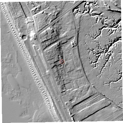 Shaded relief map of the ground around LA143YB, computed from Environment Agency LiDAR. The ground here sits at about 9 m above sea level and falls 16 m across the surrounding 800 m. Surface water reaching this point runs off ground lying to the west-north-west, 5.3 m higher.