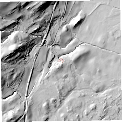 Shaded relief map of the ground around LA218AP, computed from Environment Agency LiDAR. The ground here sits at about 69 m above sea level and falls 115 m across the surrounding 800 m. Surface water reaching this point runs off ground lying to the south-west, 15.0 m higher.