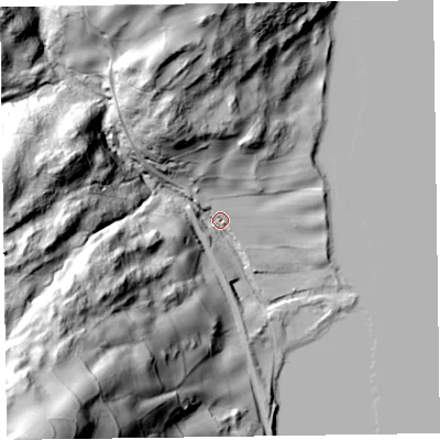 Shaded relief map of the ground around LA218BL, computed from Environment Agency LiDAR. The ground here sits at about 49 m above sea level and falls 111 m across the surrounding 800 m. Surface water reaching this point runs off ground lying to the south-west, 100.3 m higher.