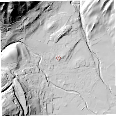 Shaded relief map of the ground around LA218DS, computed from Environment Agency LiDAR. The ground here sits at about 58 m above sea level and falls 125 m across the surrounding 800 m. Surface water reaching this point runs off ground lying to the east-north-east, 2.4 m higher.