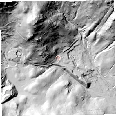 Shaded relief map of the ground around LA218HX, computed from Environment Agency LiDAR. The ground here sits at about 201 m above sea level and falls 221 m across the surrounding 800 m. Surface water reaching this point runs off ground lying to the north-west, 85.7 m higher.