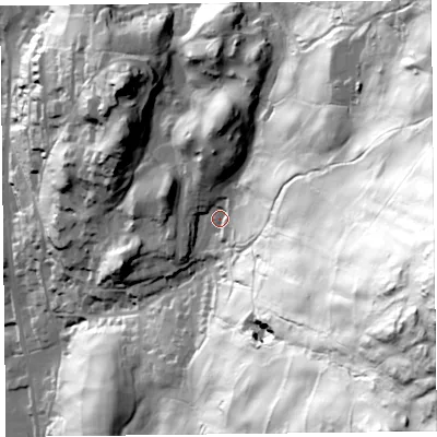 Shaded relief map of the ground around LA220AP, computed from Environment Agency LiDAR. The ground here sits at about 87 m above sea level and falls 195 m across the surrounding 800 m. Surface water reaching this point runs off ground lying to the east-south-east, 157.9 m higher.