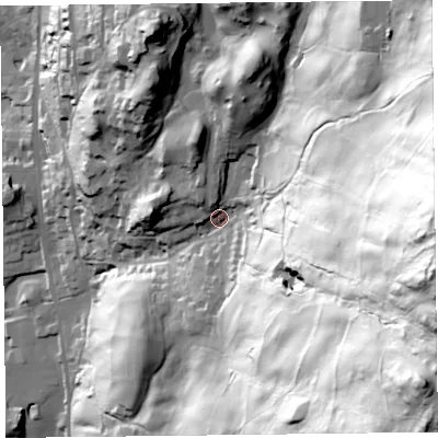 Shaded relief map of the ground around LA220AX, computed from Environment Agency LiDAR. The ground here sits at about 83 m above sea level and falls 179 m across the surrounding 800 m. Surface water reaching this point runs off ground lying to the east-south-east, 145.4 m higher.