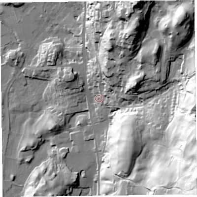 Shaded relief map of the ground around LA220DH, computed from Environment Agency LiDAR. The ground here sits at about 56 m above sea level and falls 110 m across the surrounding 800 m. Surface water reaching this point runs off ground lying to the north-east, 61.3 m higher.