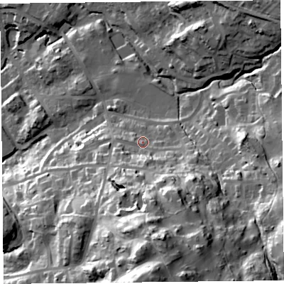 Shaded relief map of the ground around LA232DN, computed from Environment Agency LiDAR. The ground here sits at about 121 m above sea level and falls 64 m across the surrounding 800 m. Surface water reaching this point runs off ground lying to the south, 9.9 m higher.