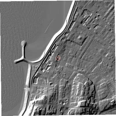 Shaded relief map of the ground around LA31DE, computed from Environment Agency LiDAR. The ground here sits at about 6 m above sea level and falls 21 m across the surrounding 800 m. Surface water reaching this point runs off ground lying to the south-south-west, 18.4 m higher.