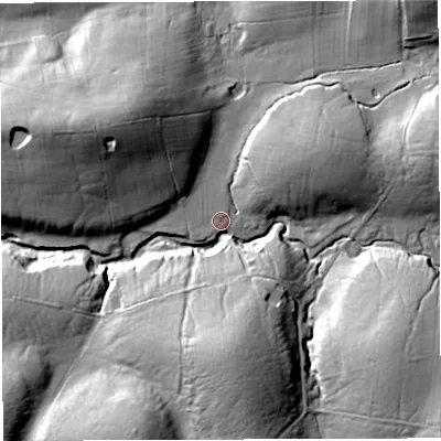 Shaded relief map of the ground around LA63DS, computed from Environment Agency LiDAR. The ground here sits at about 121 m above sea level and falls 35 m across the surrounding 800 m. Surface water reaching this point runs off ground lying to the south, 29.0 m higher.