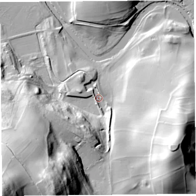 Shaded relief map of the ground around LA77AG, computed from Environment Agency LiDAR. The ground here sits at about 12 m above sea level and falls 95 m across the surrounding 800 m. Surface water reaching this point runs off ground lying to the south-south-east, 8.6 m higher.