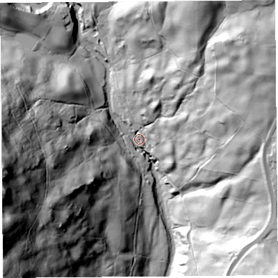 Shaded relief map of the ground around LA89AZ, computed from Environment Agency LiDAR. The ground here sits at about 121 m above sea level and falls 117 m across the surrounding 800 m. Surface water reaching this point runs off ground lying to the west-south-west, 110.3 m higher.