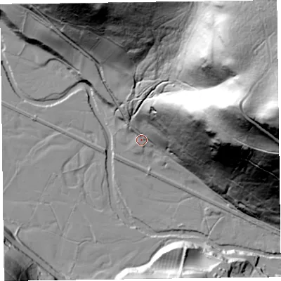 Shaded relief map of the ground around LD71TN, computed from Environment Agency LiDAR. The ground here sits at about 174 m above sea level and falls 165 m across the surrounding 800 m. Surface water reaching this point runs off ground lying to the east-north-east, 150.7 m higher.