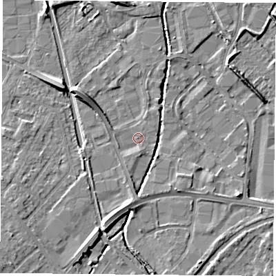 Shaded relief map of the ground around LE115XR, computed from Environment Agency LiDAR. The ground here sits at about 38 m above sea level and falls 7 m across the surrounding 800 m. Surface water reaching this point runs off ground lying to the south, 2.4 m higher.