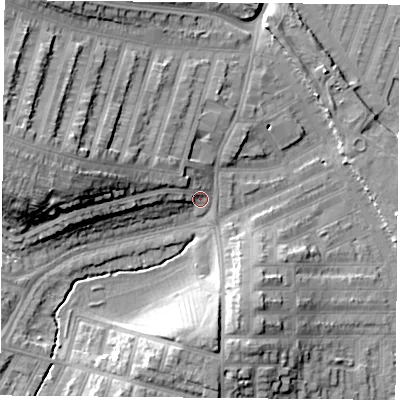 Shaded relief map of the ground around LE35EX, computed from Environment Agency LiDAR. The ground here sits at about 57 m above sea level and falls 20 m across the surrounding 800 m. Surface water reaching this point runs off ground lying to the west, 12.4 m higher.