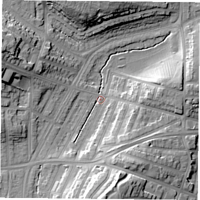 Shaded relief map of the ground around LE36AR, computed from Environment Agency LiDAR. The ground here sits at about 59 m above sea level and falls 22 m across the surrounding 800 m. Surface water reaching this point runs off ground lying to the west-north-west, 17.9 m higher.
