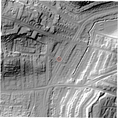 Shaded relief map of the ground around LE36DW, computed from Environment Agency LiDAR. The ground here sits at about 60 m above sea level and falls 26 m across the surrounding 800 m. Surface water reaching this point runs off ground lying to the north-west, 19.4 m higher.