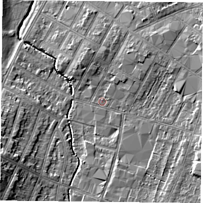 Shaded relief map of the ground around LE55FF, computed from Environment Agency LiDAR. The ground here sits at about 65 m above sea level and falls 12 m across the surrounding 800 m. Surface water reaching this point runs off ground lying to the south-east, 5.1 m higher.