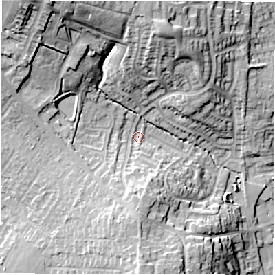 Shaded relief map of the ground around LE652NN, computed from Environment Agency LiDAR. The ground here sits at about 133 m above sea level and falls 32 m across the surrounding 800 m. Surface water reaching this point runs off ground lying to the south, 11.1 m higher.