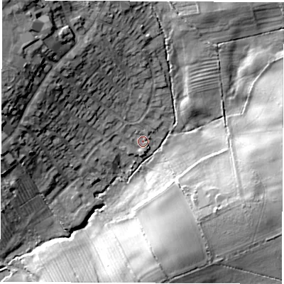 Shaded relief map of the ground around LE676LX, computed from Environment Agency LiDAR. The ground here sits at about 122 m above sea level and falls 25 m across the surrounding 800 m. Surface water reaching this point runs off ground lying to the north-west, 11.5 m higher.