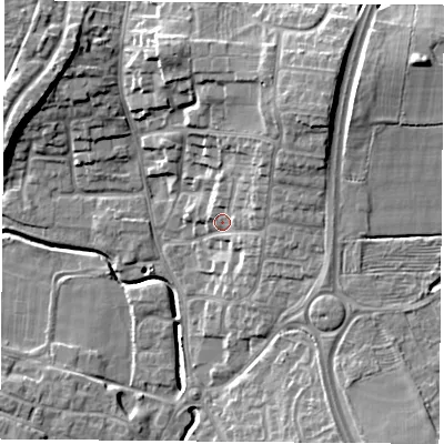 Shaded relief map of the ground around LE86LU, computed from Environment Agency LiDAR. The ground here sits at about 69 m above sea level and falls 14 m across the surrounding 800 m. Surface water reaching this point runs off ground lying to the north-east, 7.6 m higher.