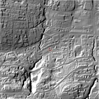 Shaded relief map of the ground around LS299PY, computed from Environment Agency LiDAR. The ground here sits at about 99 m above sea level and falls 89 m across the surrounding 800 m. Surface water reaching this point runs off ground lying to the south-west, 67.7 m higher.