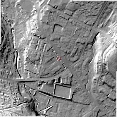 Shaded relief map of the ground around LS64AW, computed from Environment Agency LiDAR. The ground here sits at about 62 m above sea level and falls 42 m across the surrounding 800 m. Surface water reaching this point runs off ground lying to the north-north-west, 4.8 m higher.