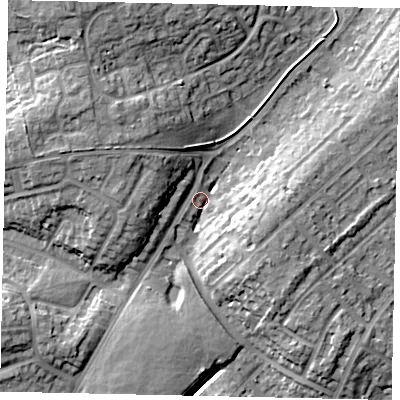 Shaded relief map of the ground around LU32JL, computed from Environment Agency LiDAR. The ground here sits at about 115 m above sea level and falls 15 m across the surrounding 800 m. Surface water reaching this point runs off ground lying to the west-north-west, 9.7 m higher.