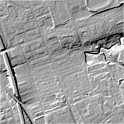 Shaded relief map of the ground around M124PF, computed from Environment Agency LiDAR. The ground here sits at about 52 m above sea level and falls 18 m across the surrounding 800 m. Surface water reaching this point runs off ground lying to the north-east, 11.6 m higher.