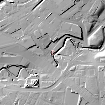 Shaded relief map of the ground around M12WG, computed from Environment Agency LiDAR. The ground here sits at about 38 m above sea level and falls 20 m across the surrounding 800 m. Surface water reaching this point runs off ground lying to the north, 15.5 m higher.