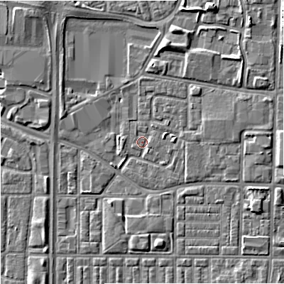 Shaded relief map of the ground around M144GW, computed from Environment Agency LiDAR. The ground here sits at about 33 m above sea level and falls 6 m across the surrounding 800 m. Surface water reaching this point runs off ground lying to the east-north-east, 2.6 m higher.