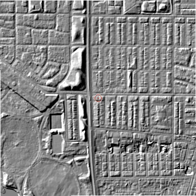 Shaded relief map of the ground around M144RD, computed from Environment Agency LiDAR. The ground here sits at about 33 m above sea level and falls 7 m across the surrounding 800 m. Surface water reaching this point runs off ground lying to the east, 2.1 m higher.