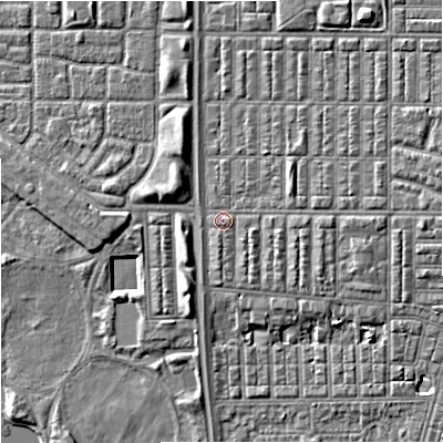 Shaded relief map of the ground around M144RR, computed from Environment Agency LiDAR. The ground here sits at about 33 m above sea level and falls 7 m across the surrounding 800 m. Surface water reaching this point runs off ground lying to the east, 2.1 m higher.